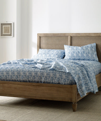 bed made with blue bodhi printed microfiber sheet set